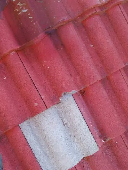 Ridge capping being repaired — after