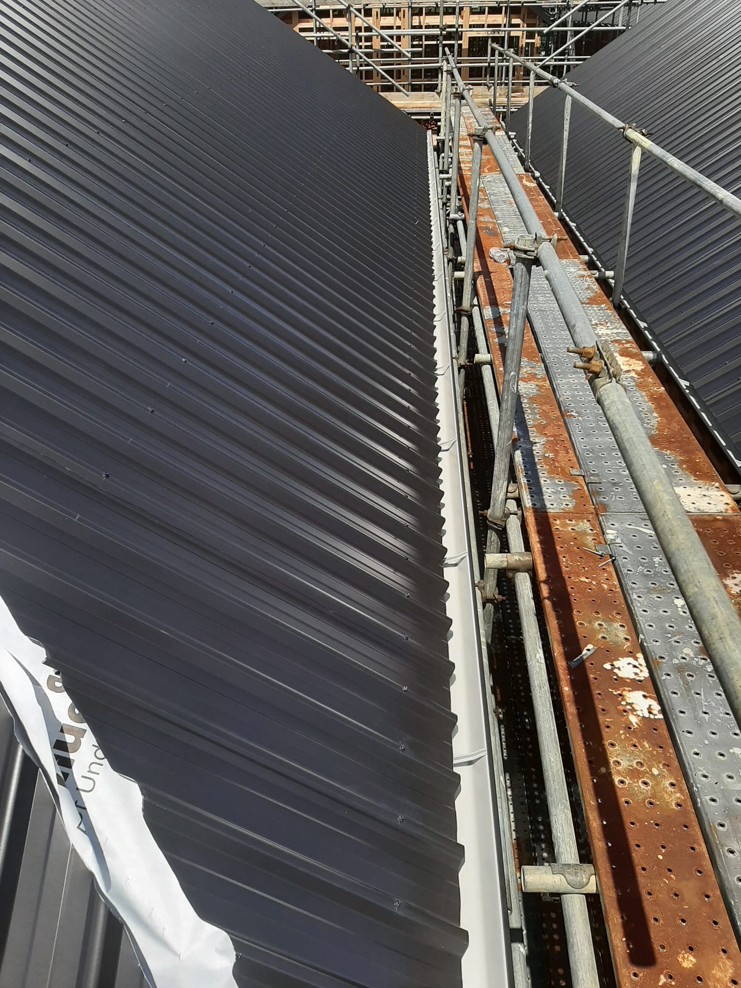 Internal gutter and valley flashing on Coloursteel re-roof â€” Auckland